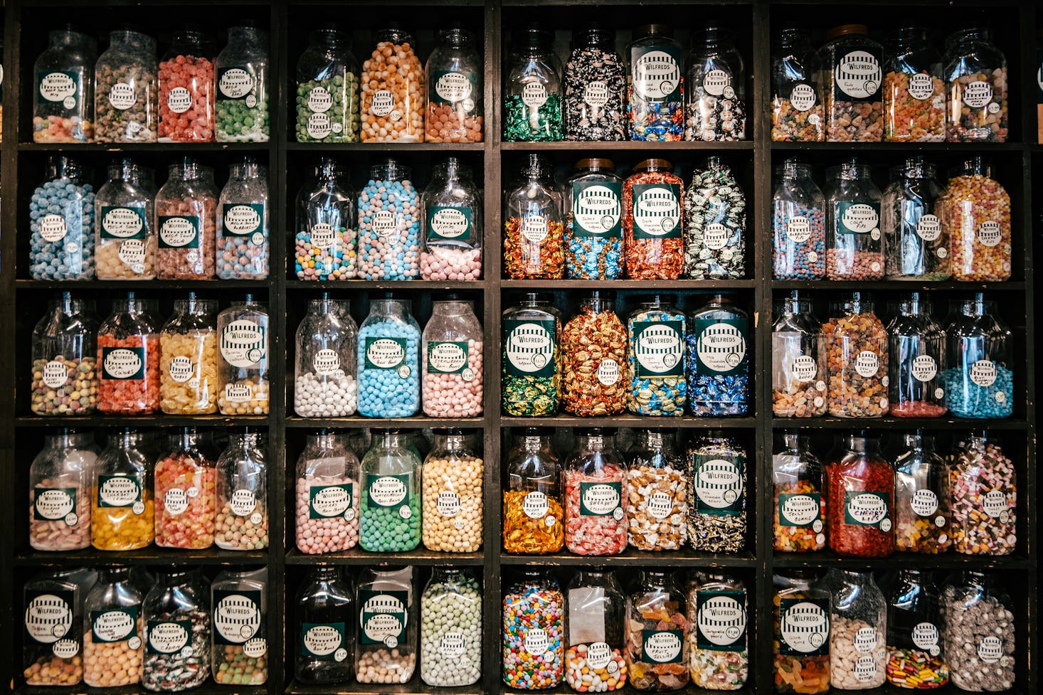 A wall of old-fashioned sweets in jars in Cambridge