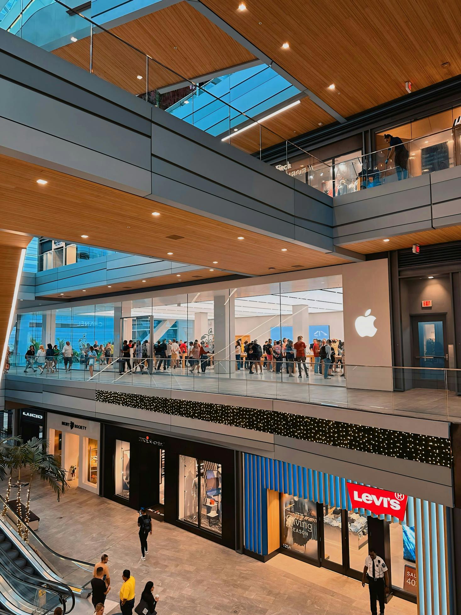 The interior of a shopping mall in Miami with the Levi's and Apple store visible