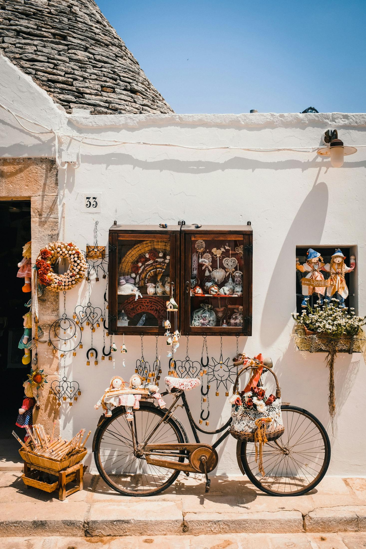 A high-end souvenir store in Bari with a bicycle parked out front