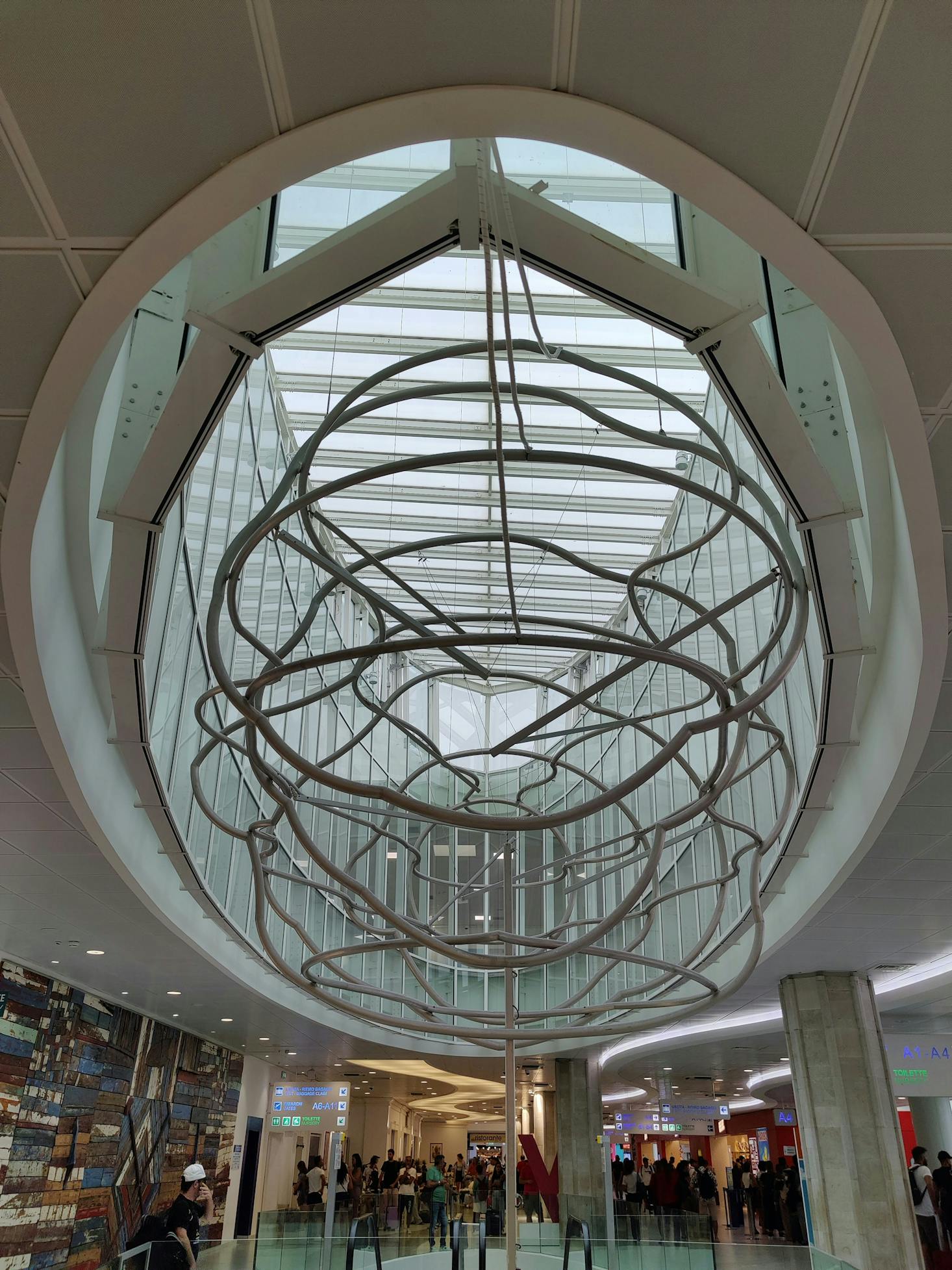 People shopping at the modern airport in Bari, Italy