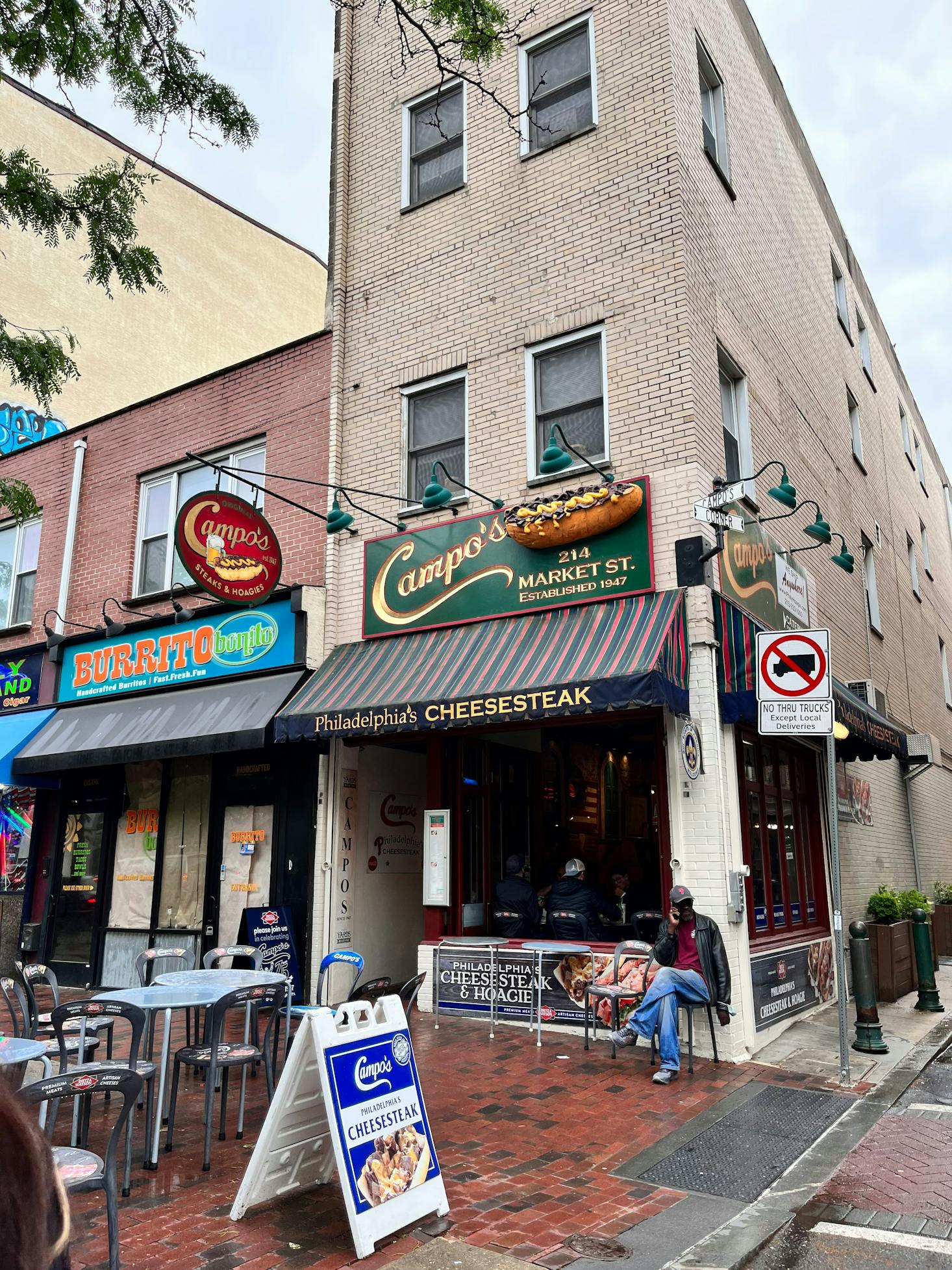 Philly street-side restaurants and shops on a rainy day