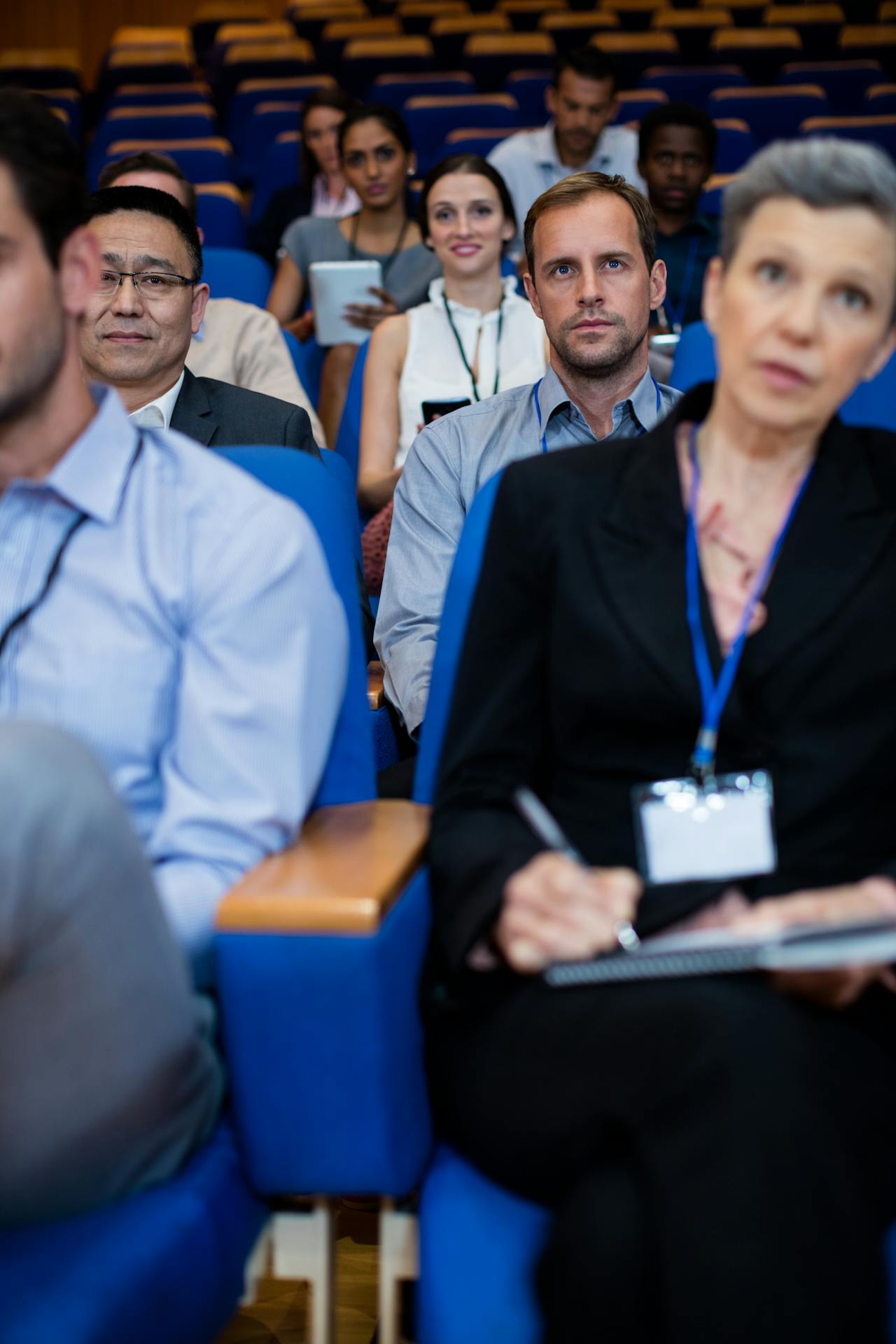 Attentive participants seated in rows, listening to insightful presentations during the conference