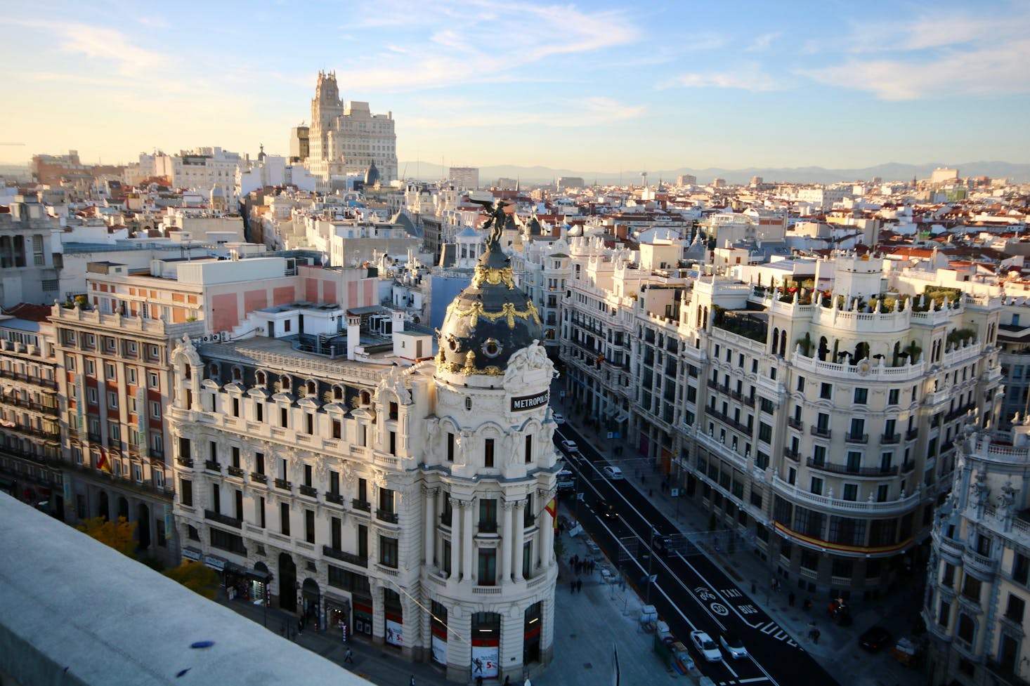 Gran Vía in Madrid, showcasing the iconic Metropolis Building and surrounding architecture