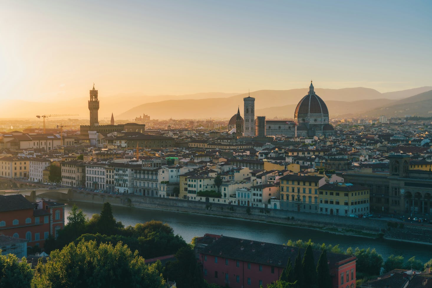 Aerial view of Florence city with the sunset casting shadows over buildings