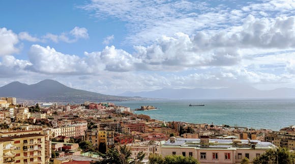 Colorful architecture in Naples next to the sea and mountain