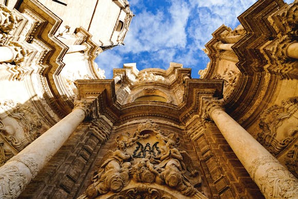 Low-angle view of the Valencia Cathedral and blue sky