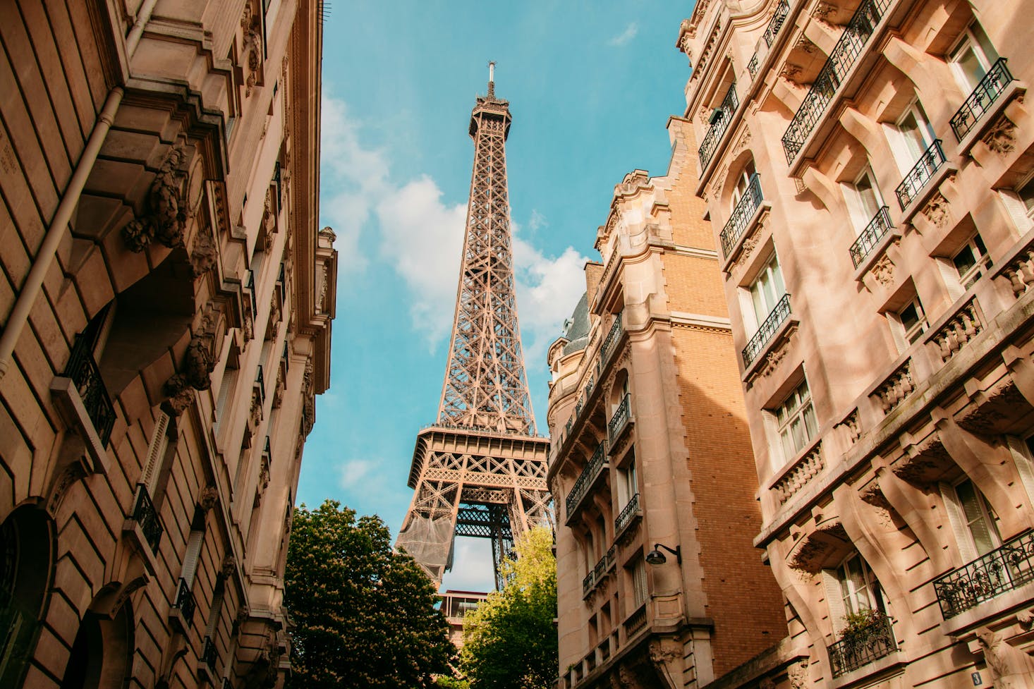 Eiffel tower shot from a street in Paris during daytime