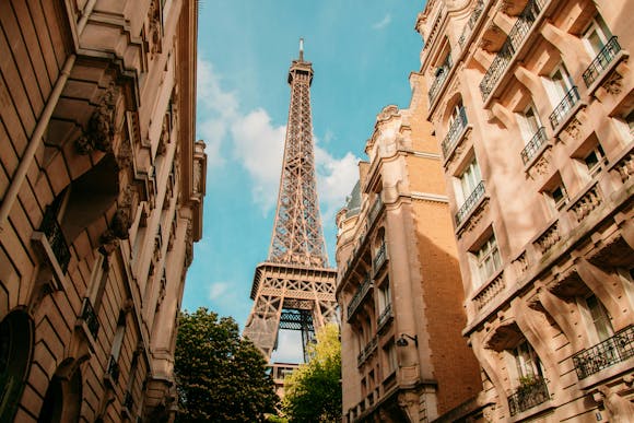 Eiffel tower shot from a street in Paris during daytime