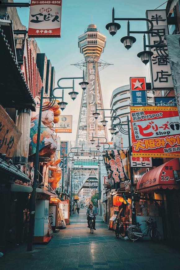 A street in Osaka, with many colorful billboards, signs, and shops