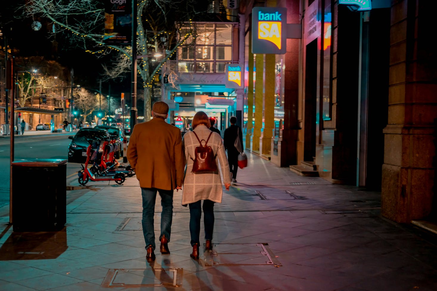 A couple walking on the streets near Adelaide Central Bus Station