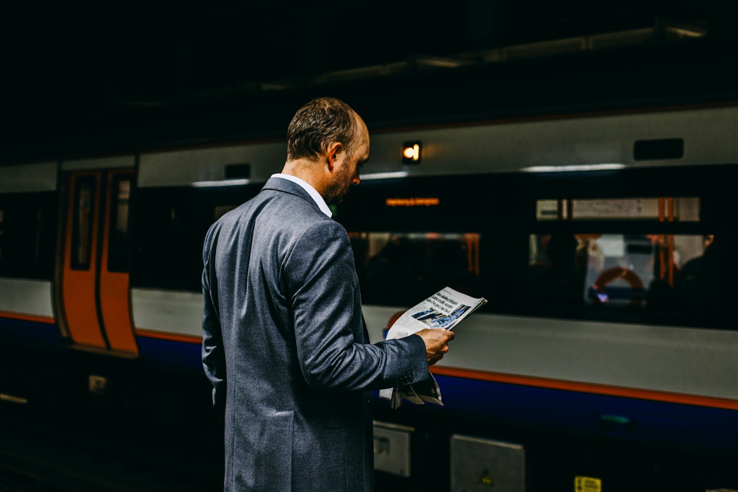 Person waiting for a train at Reading Train Station