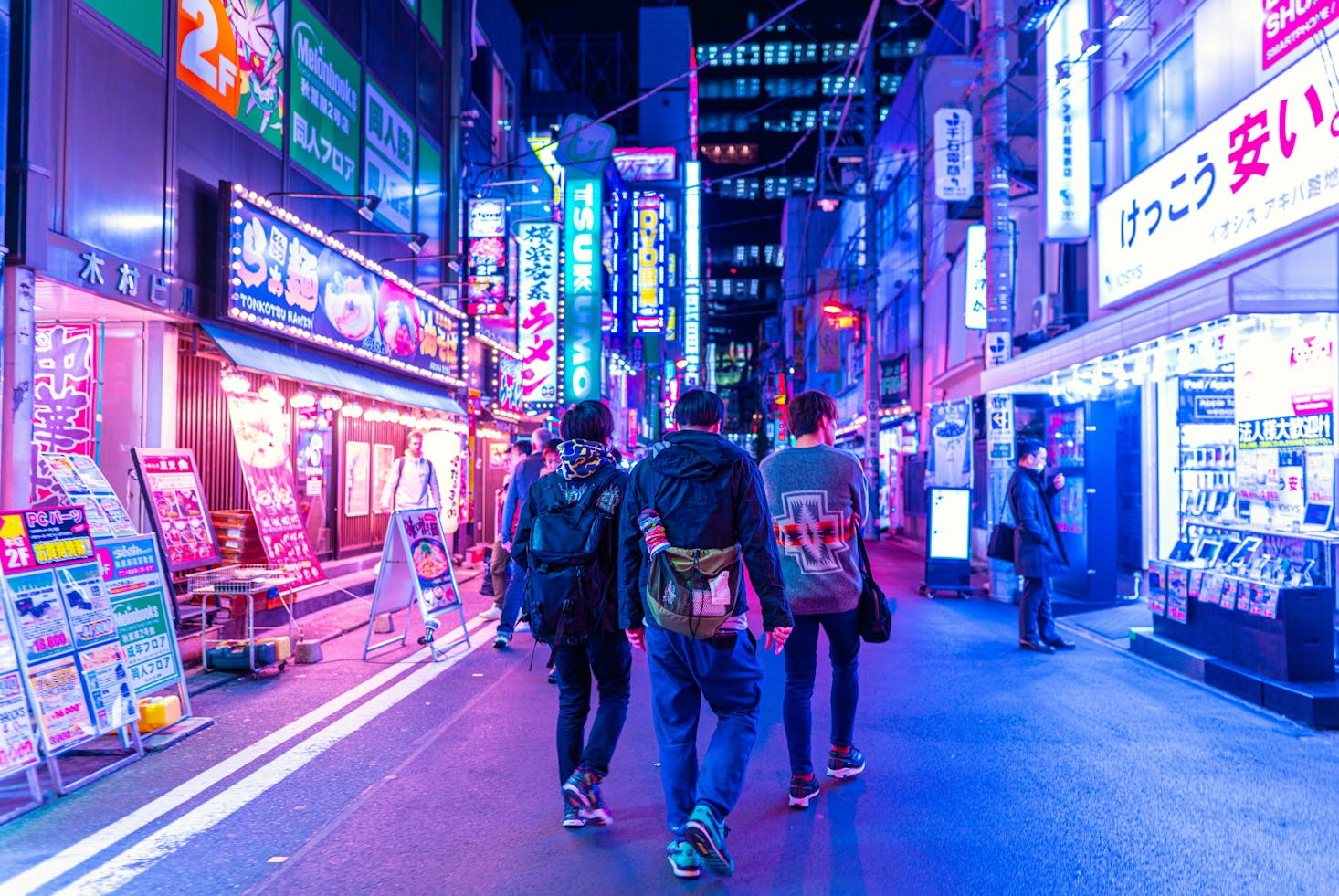 People walking at night near Akihabara Station