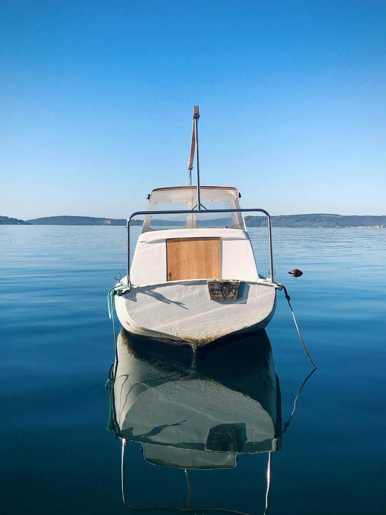 Boat in the water near Kaštel Štafilić Boat in the water near Kaštel Štafilić