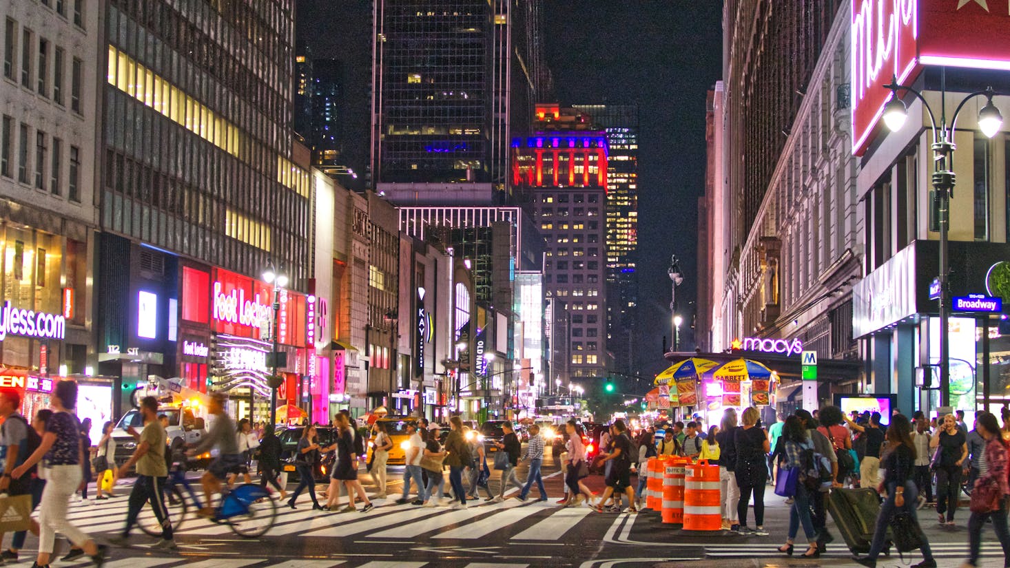 Busy Broadway Street in New York lit up at night