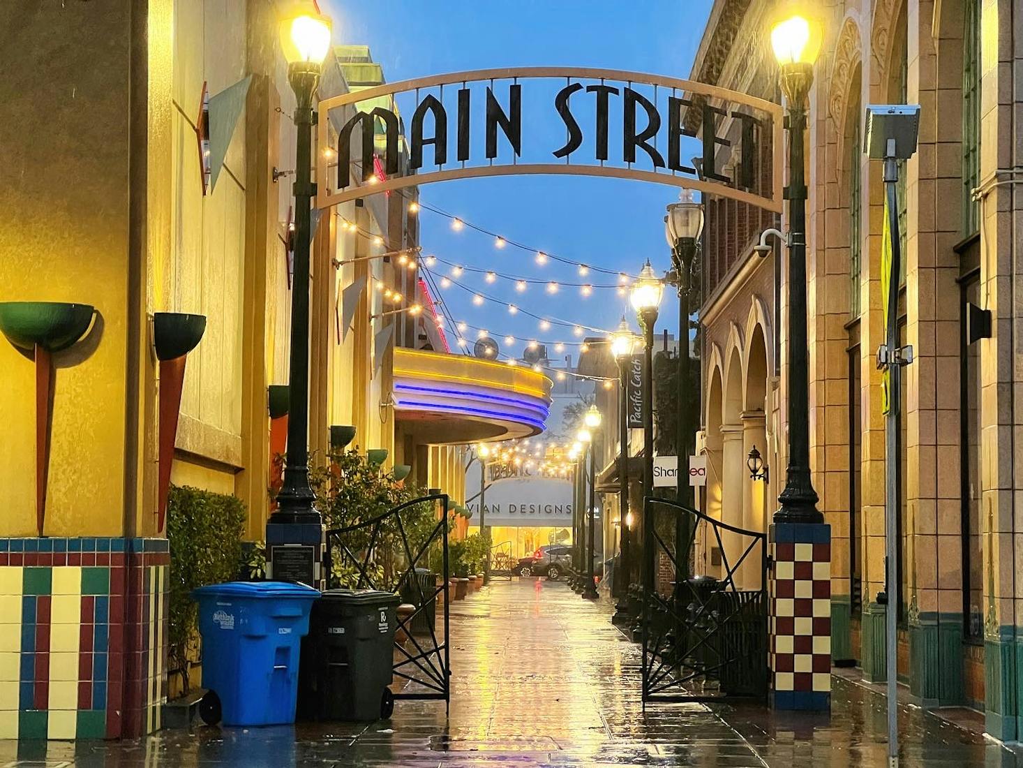 A bustling Main Street USA with charming storefronts and colorful awnings