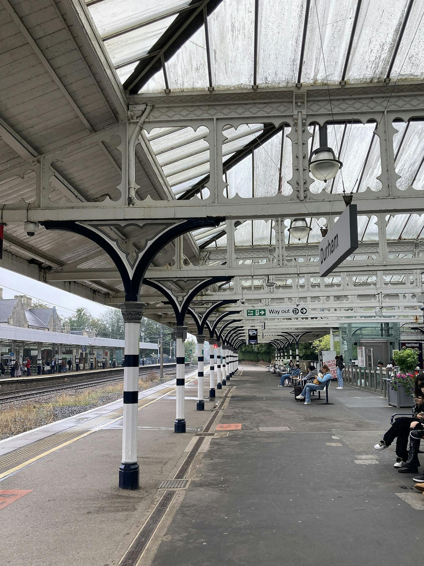 Durham Station platform with people waiting for the train