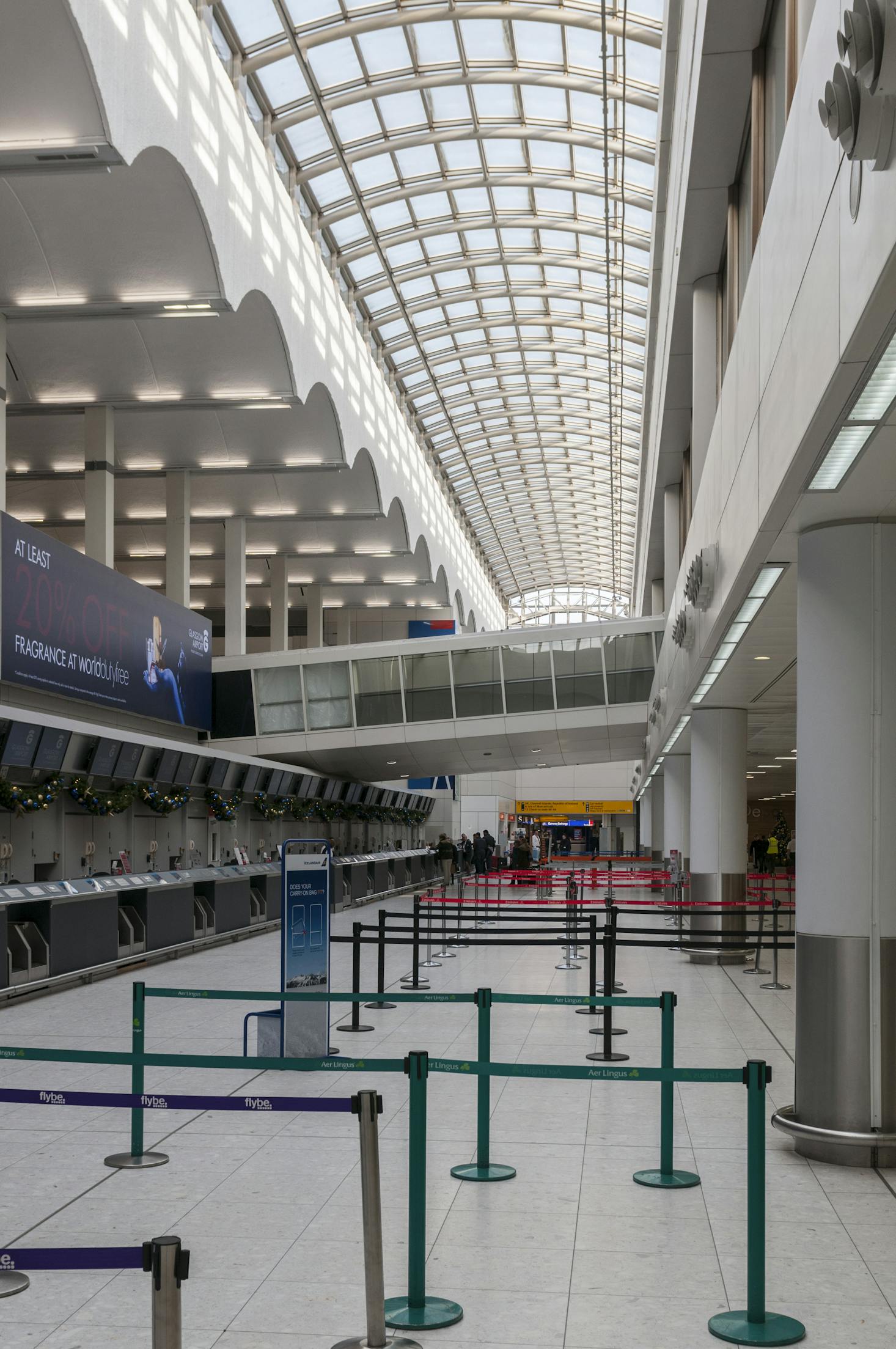 Ready to welcome flyers at Glasgow Airport's empty check-in desks.