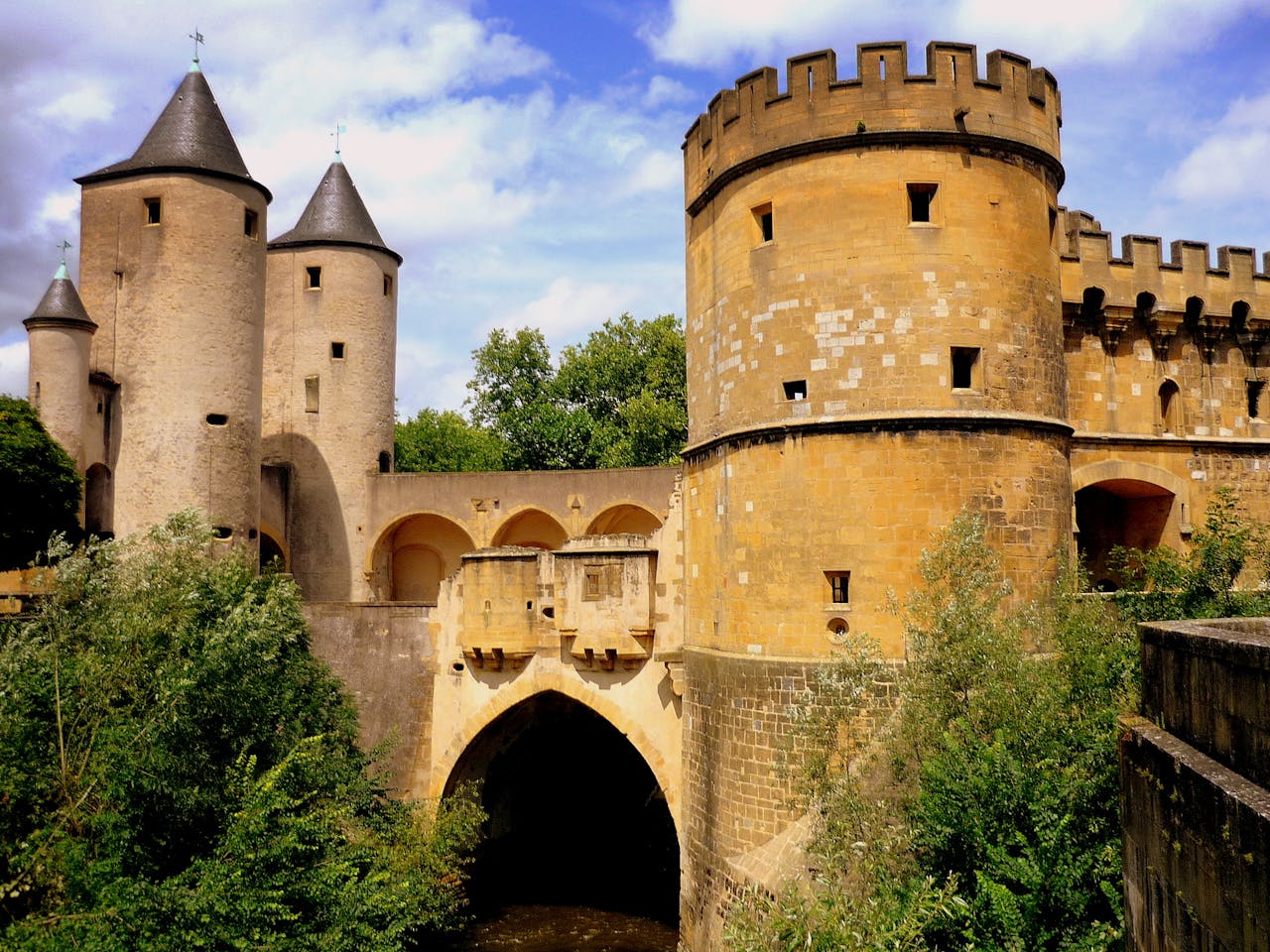 The historic and imposing towers of the medieval bridge at Metz, France.