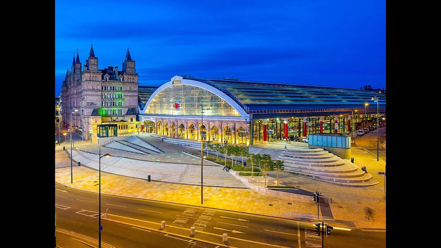 Liverpool Lime Street Station, beautifully illuminated in the evening.