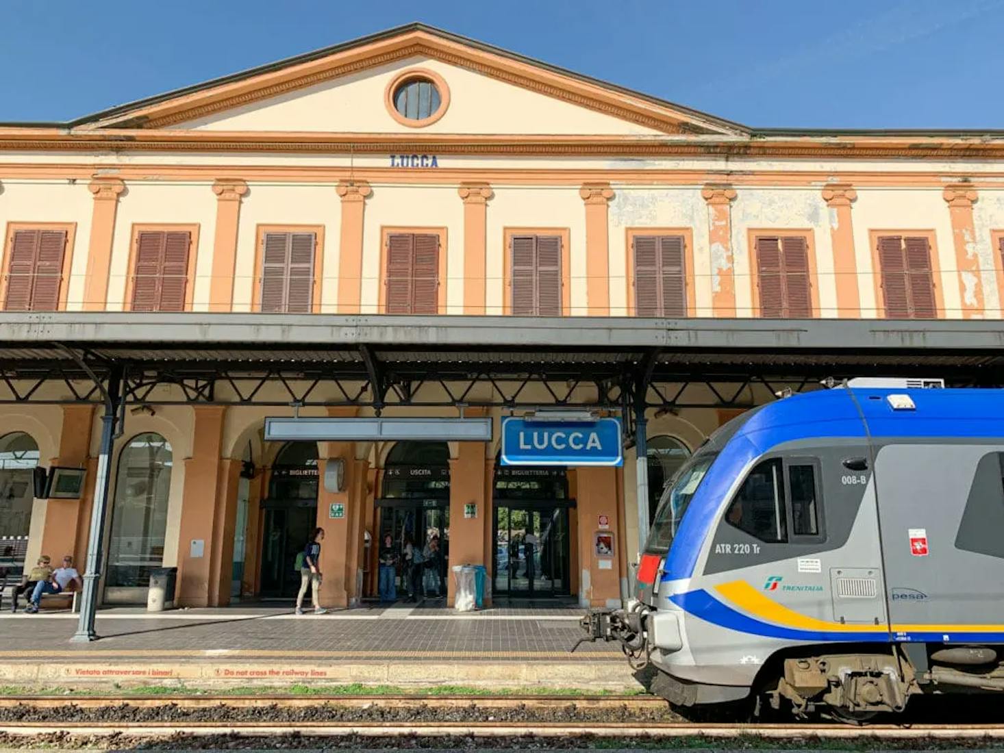 Lucca railway station in Tuscany, Italy, featuring its charming historic facade.