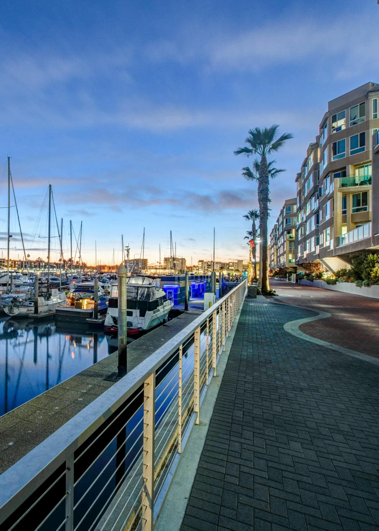 A serene evening at Marina del Rey in California, with boats docked in the calm waters.