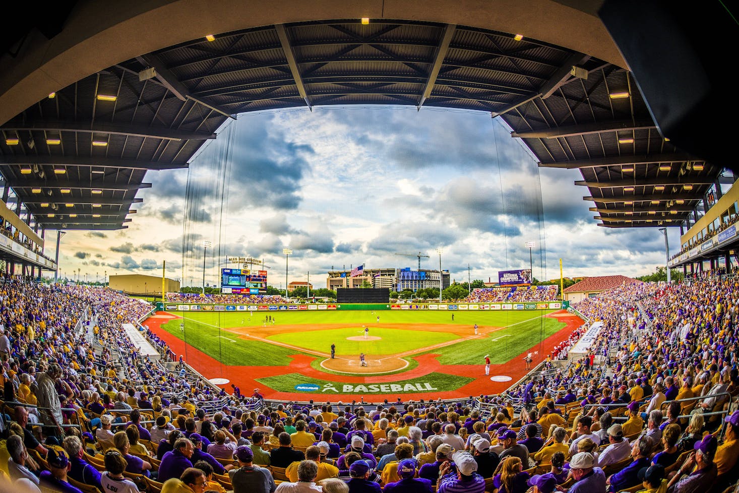 Packed Alex Box Stadium during a baseball game, with fans filling the stands