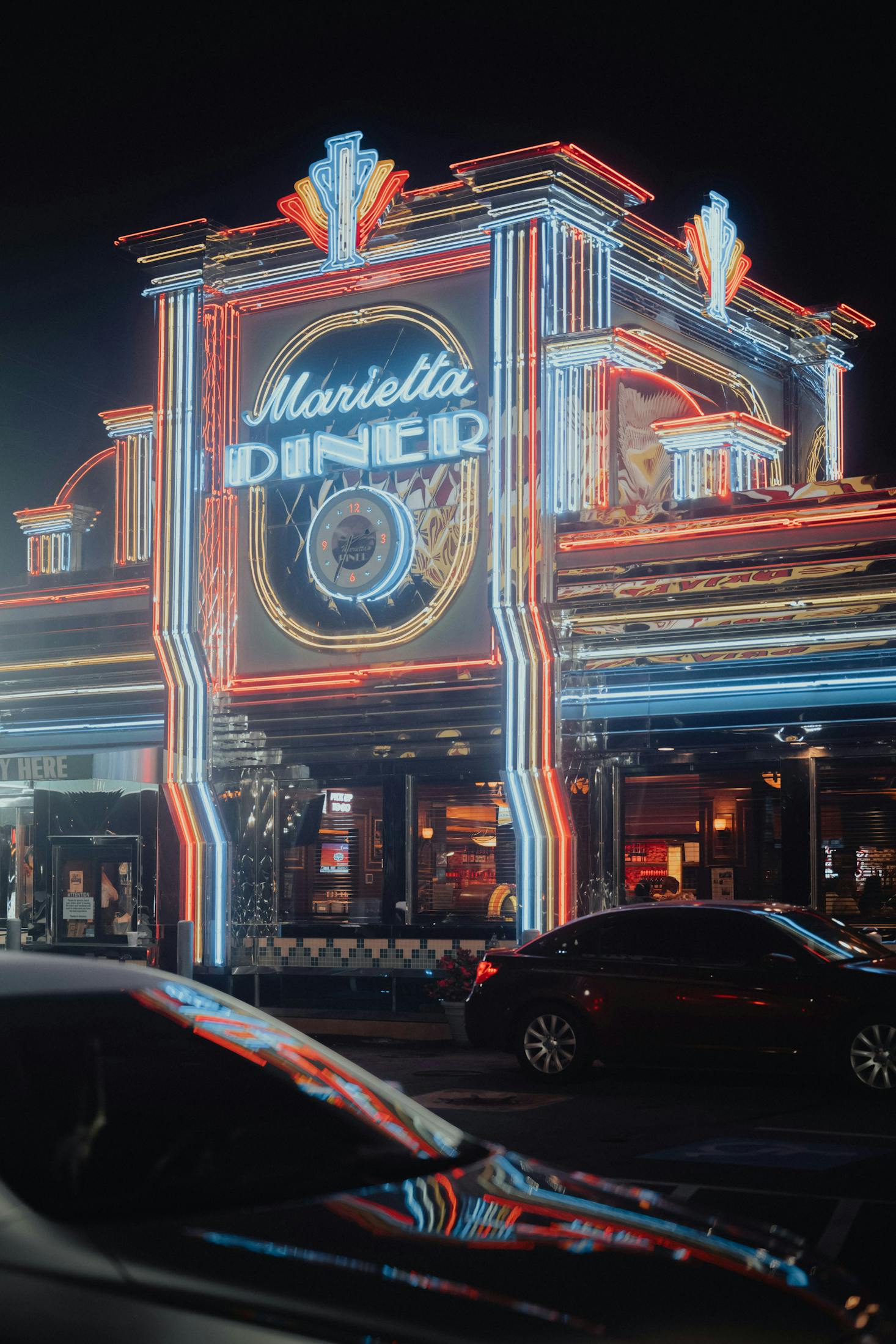 The Marietta Diner shines brightly at night with its iconic neon lights.