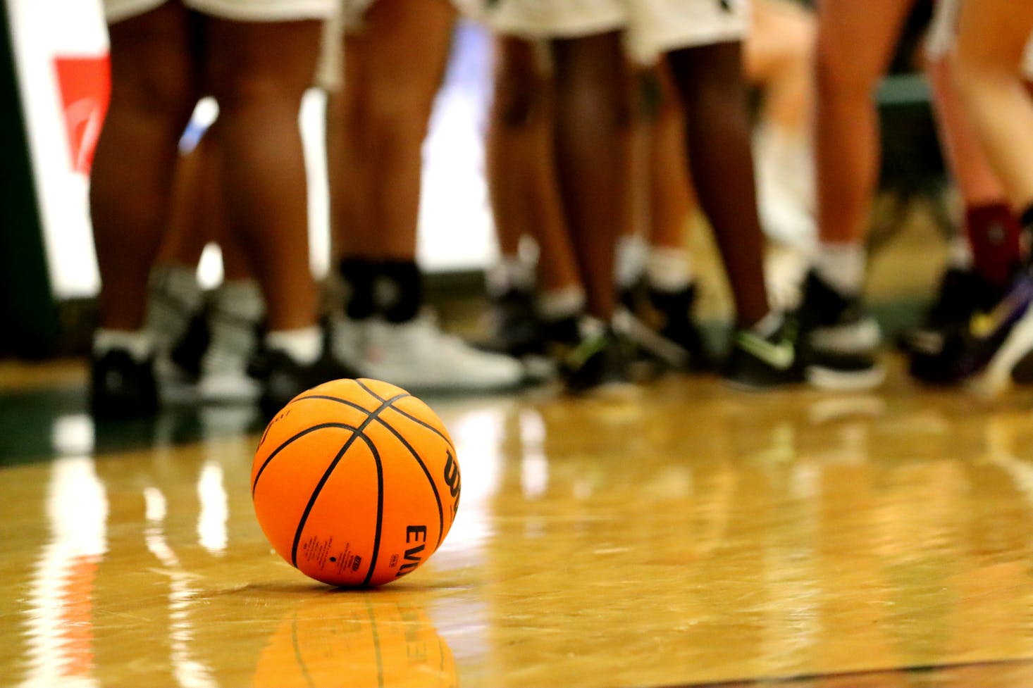 "Game On: A basketball lies on the court of State Farm Arena as players prepare.