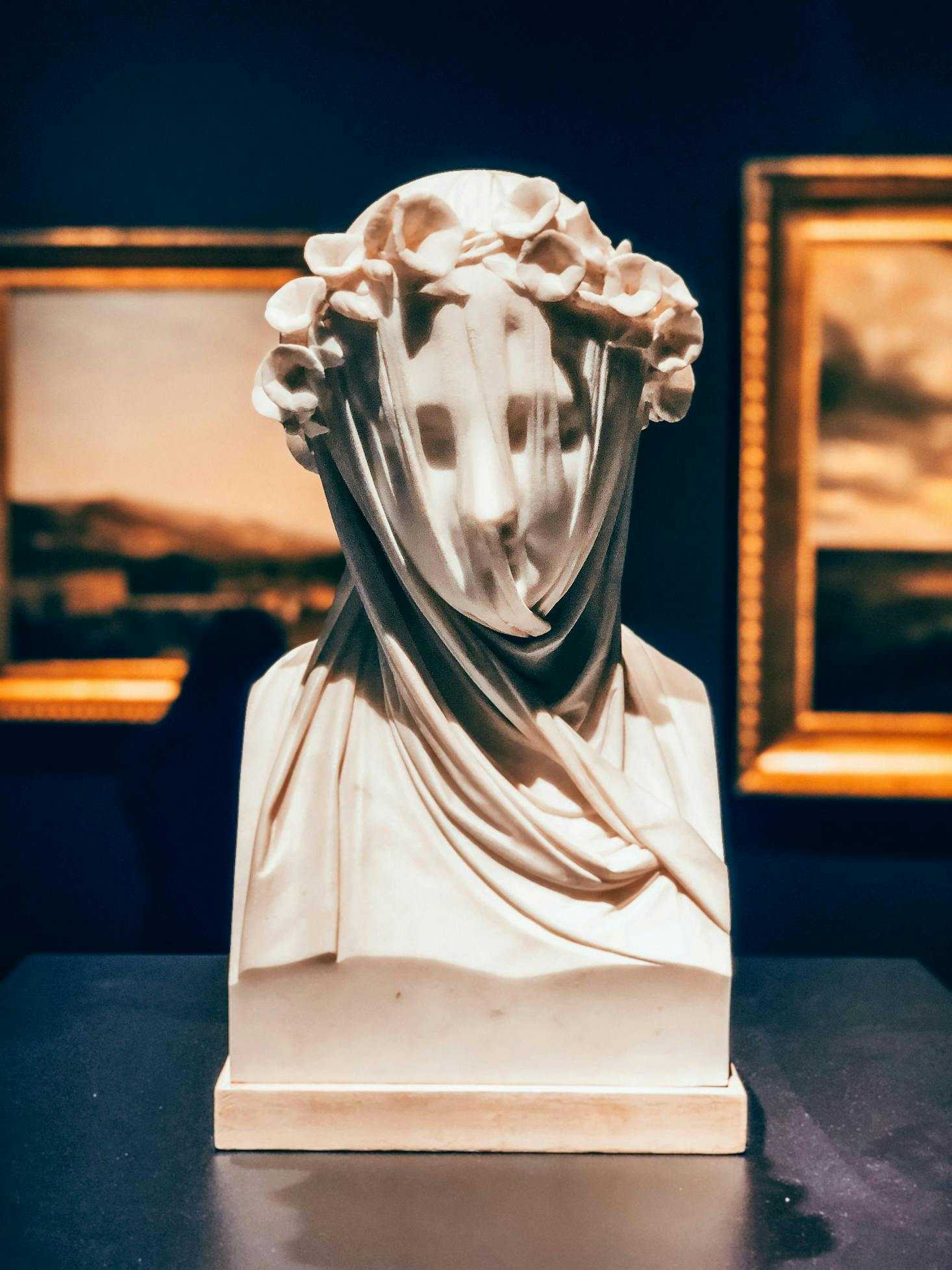 A bust sculpture over a table in a museum in Wallington.