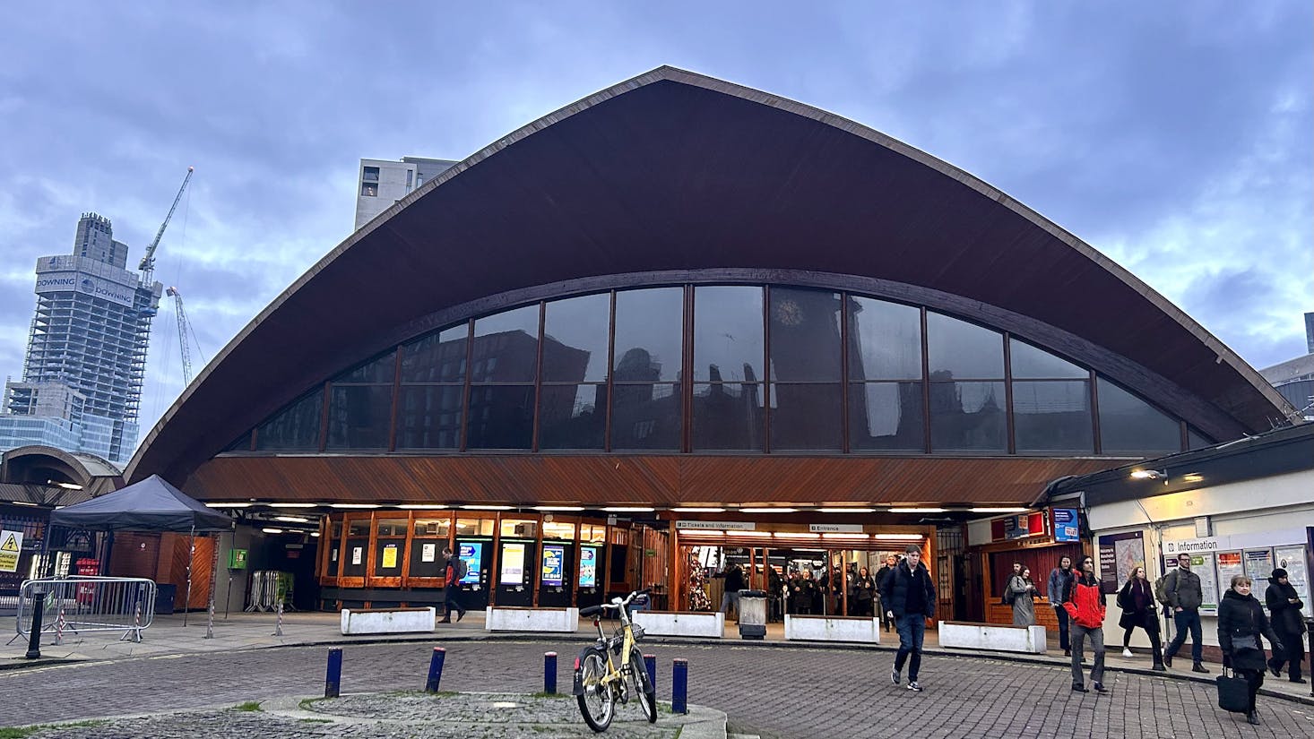 Oxford Railway Station, a modern train station with a distinctive arched roof and large glass windows