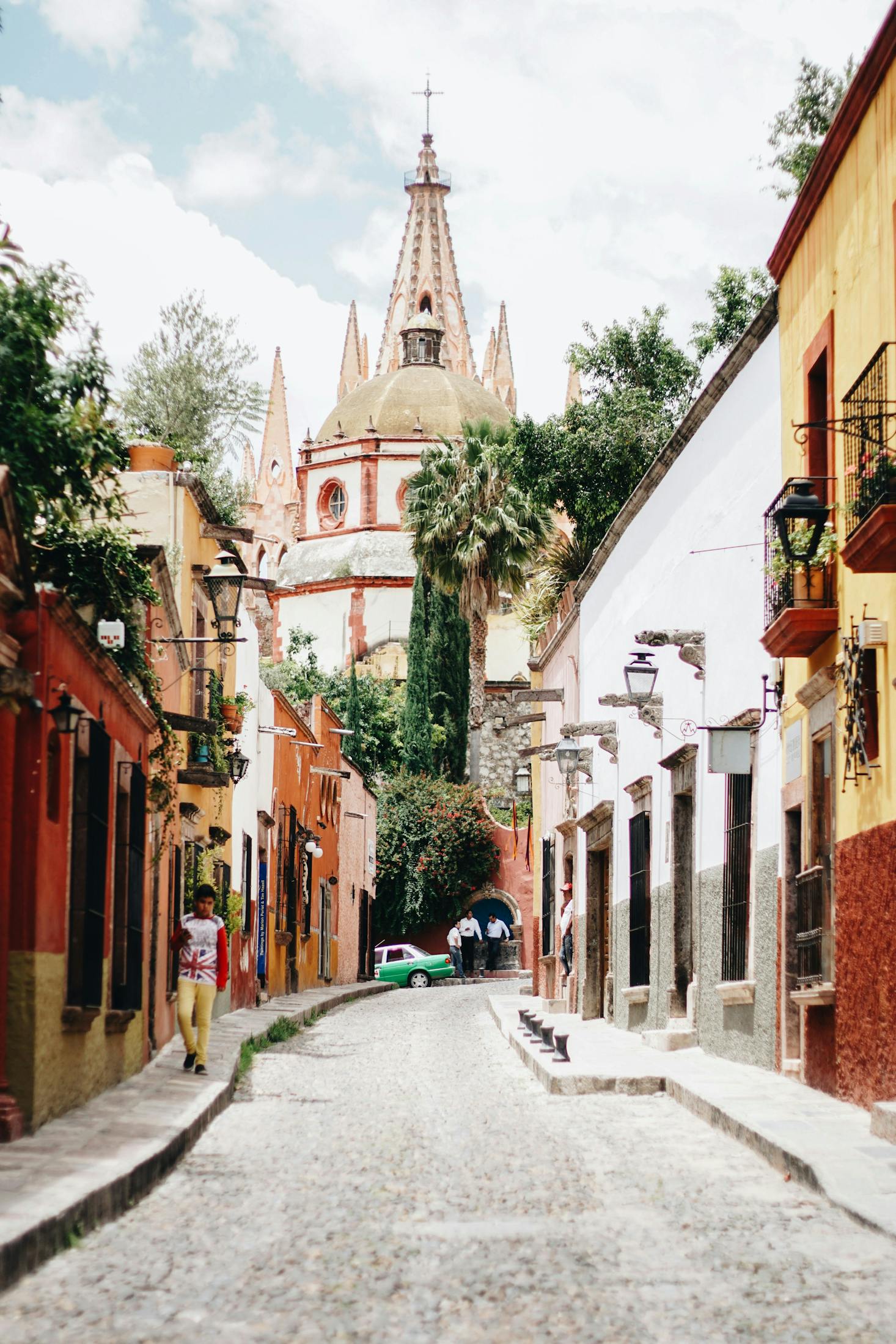 Mexico City street with a church in the distance