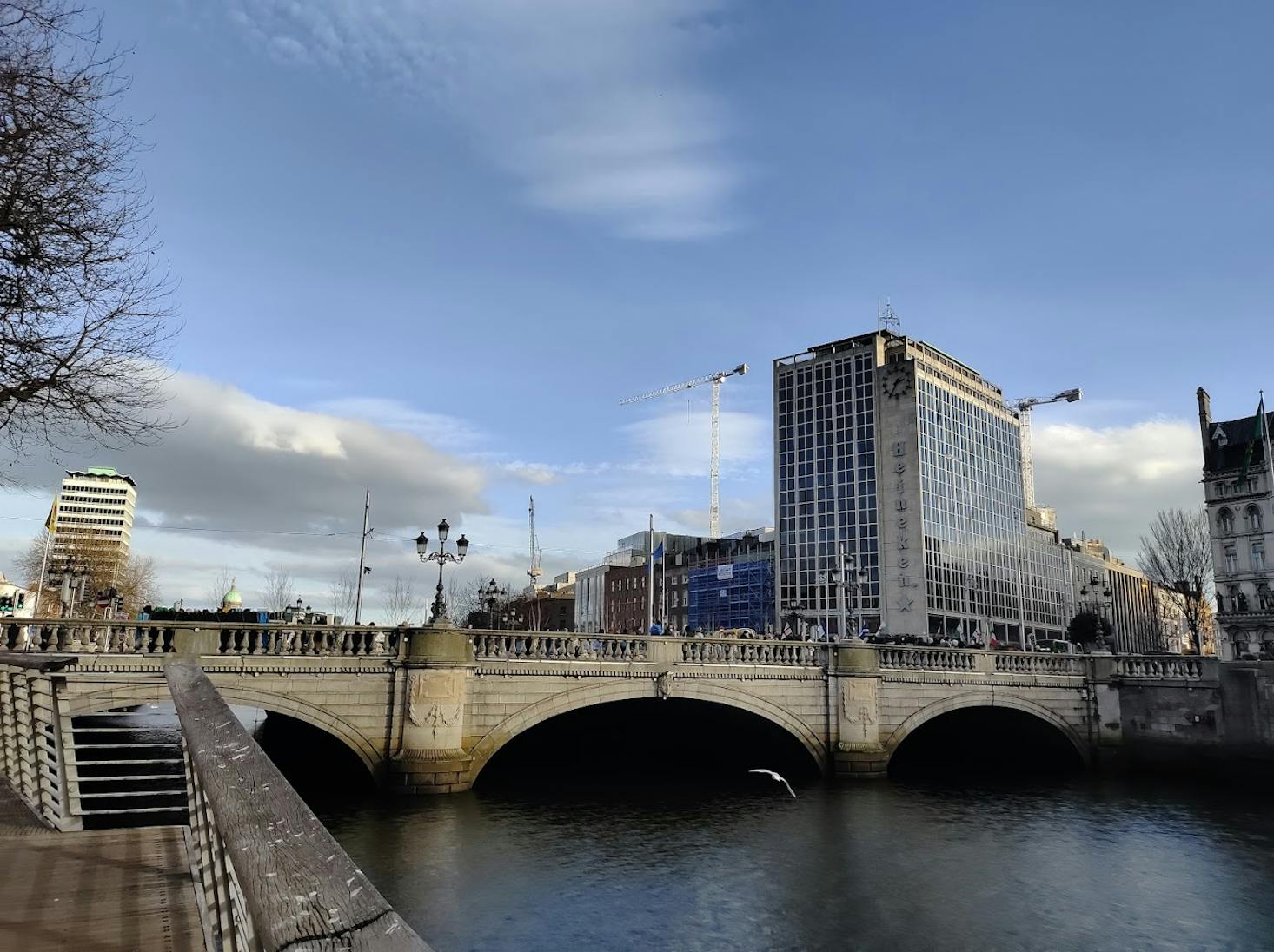 O’Connell Bridge in Dublin, spanning over a river with buildings