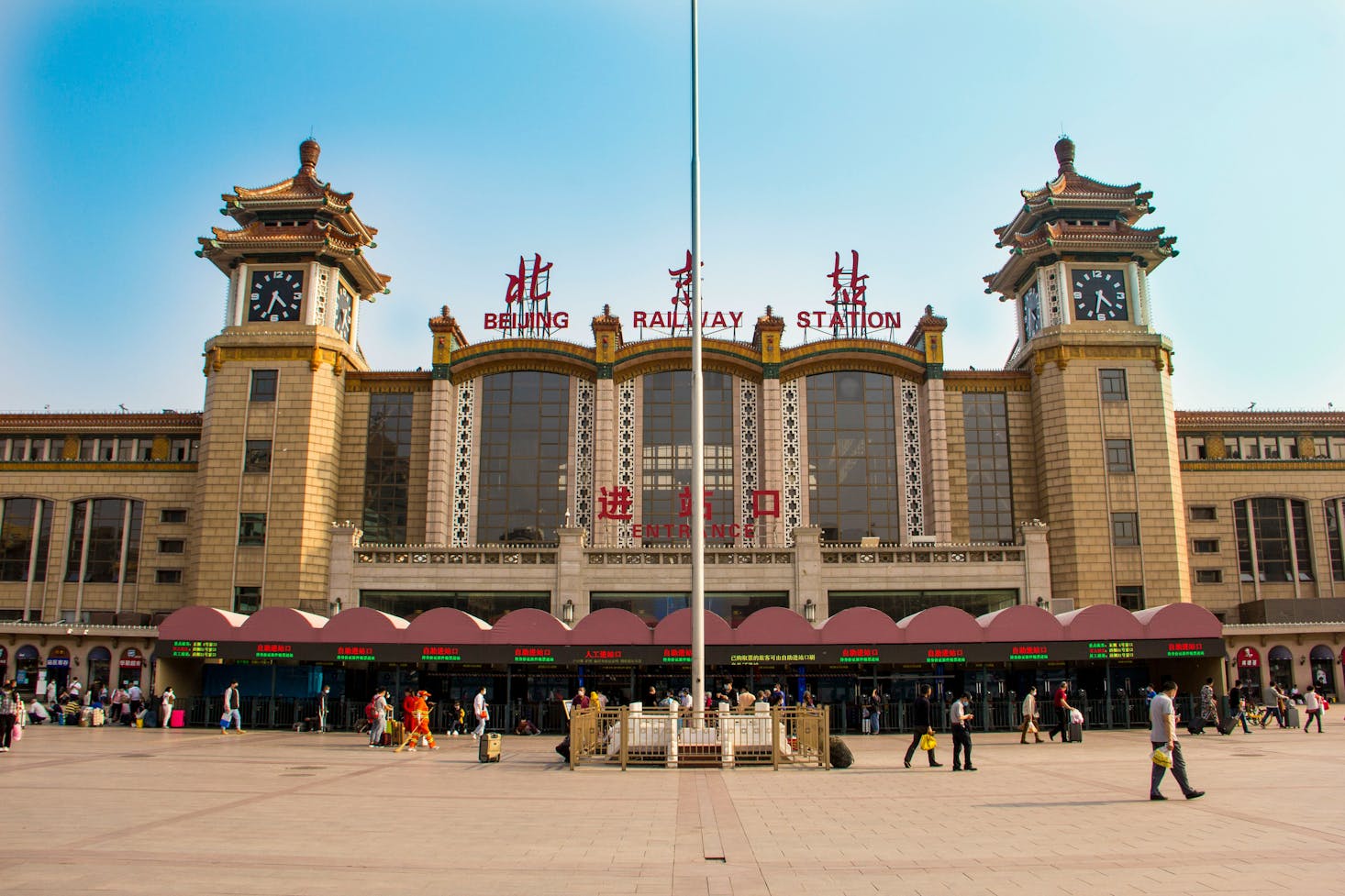 The exterior of Beijing Railway Station in Beijing, China is impressive against a blue sky