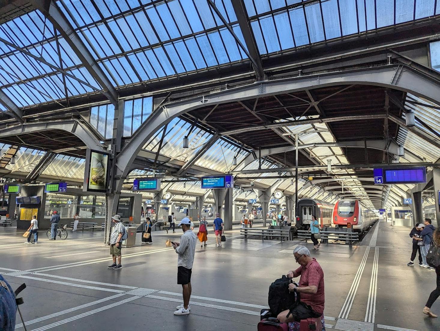 Zurich HB Main Station, featuring a spacious and bustling platform 