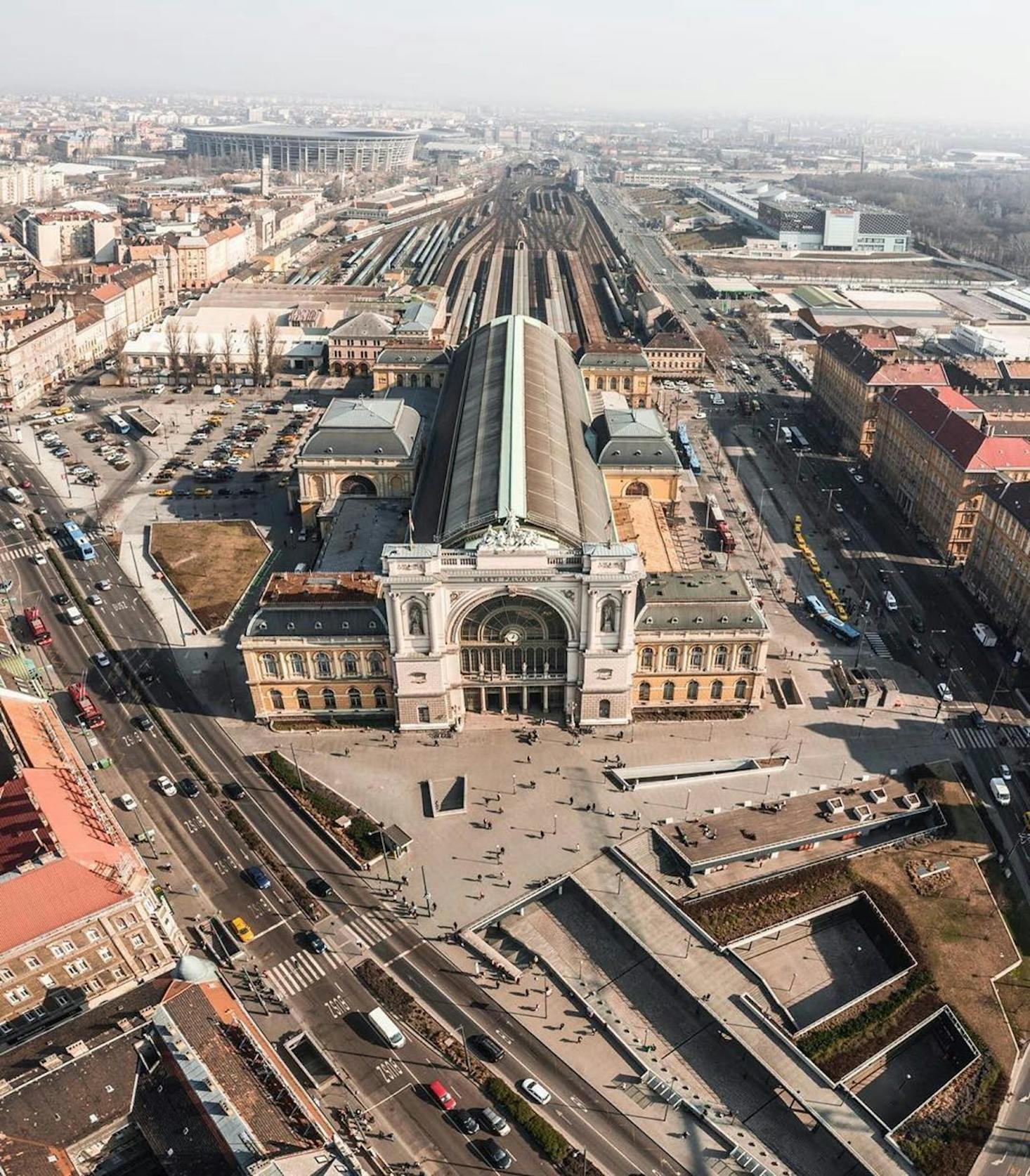 Aerial view of Keleti Station, historic train station surrounded by urban buildings and roads.