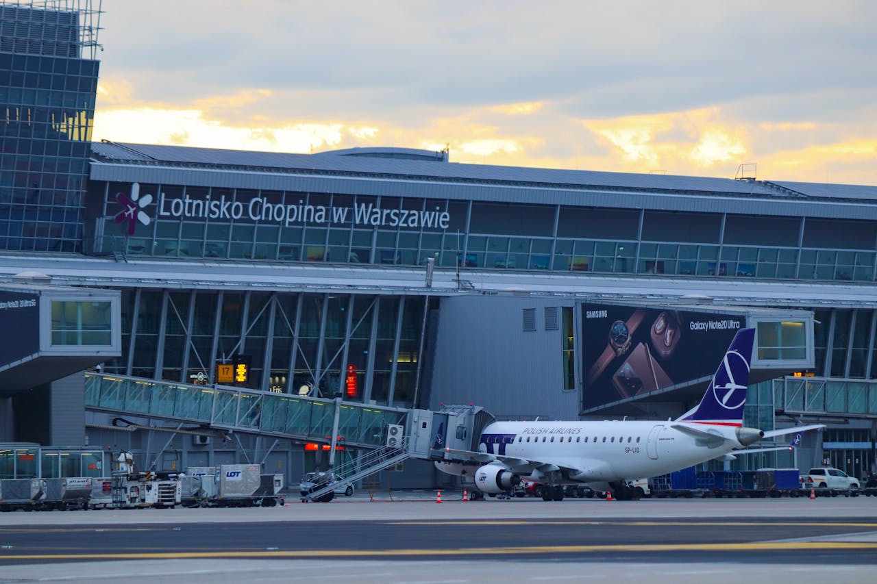 Warsaw Chopin Airport, featuring a LOT Polish Airlines plane parked