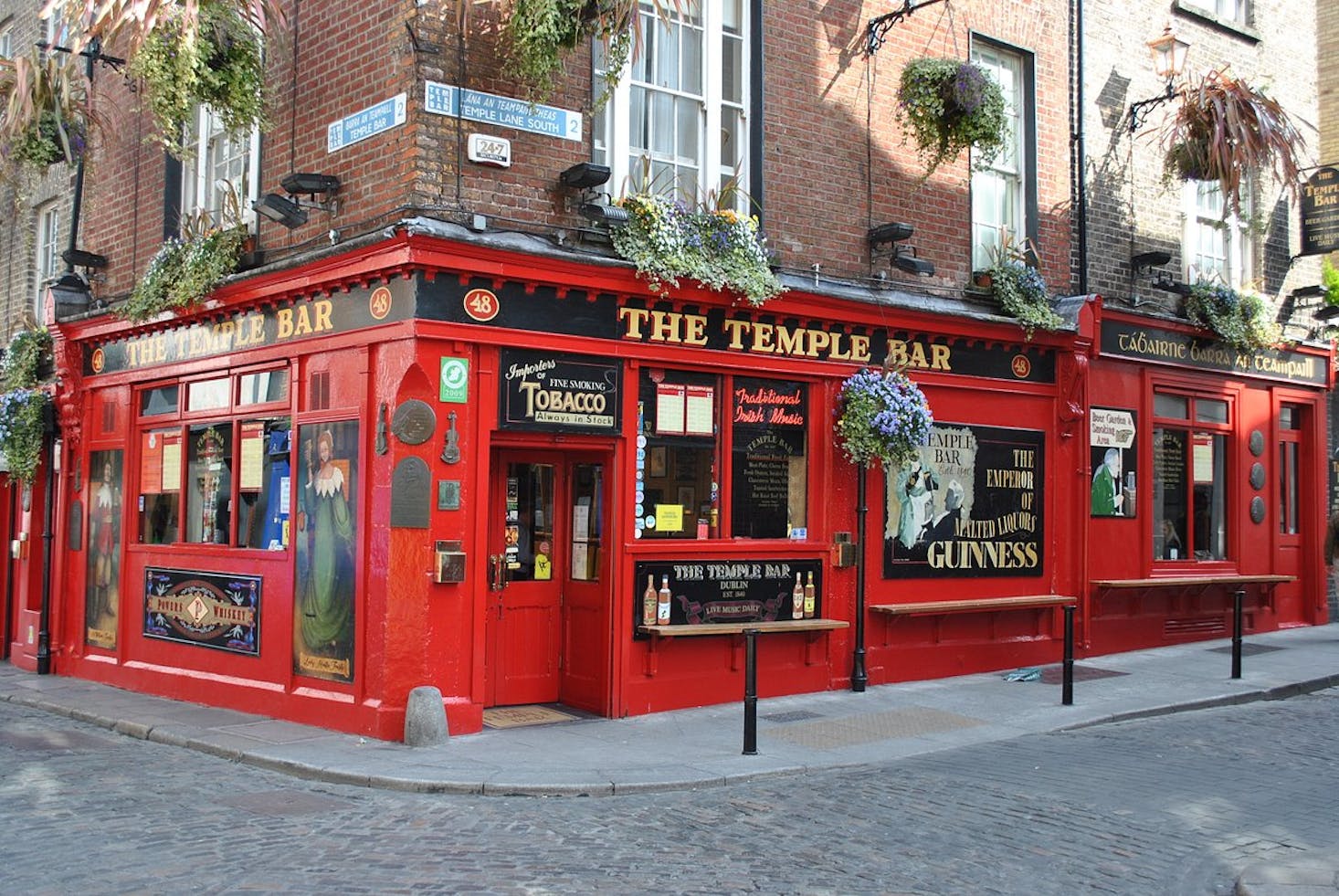 The vibrant red exterior of The Temple Bar, a famous pub in Dublin