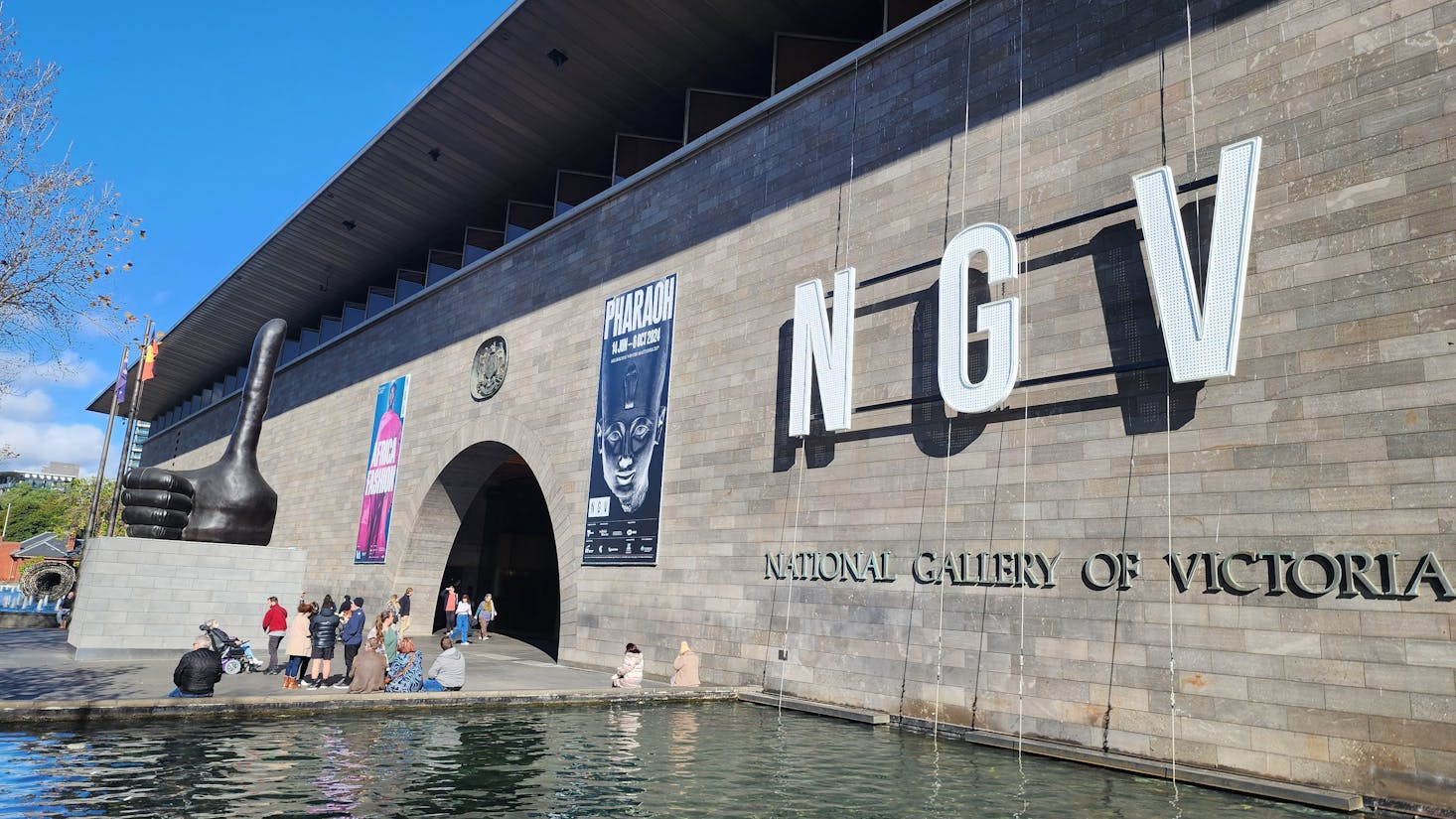 The entrance of the National Gallery of Victoria, featuring large "NGV" letters on the facade