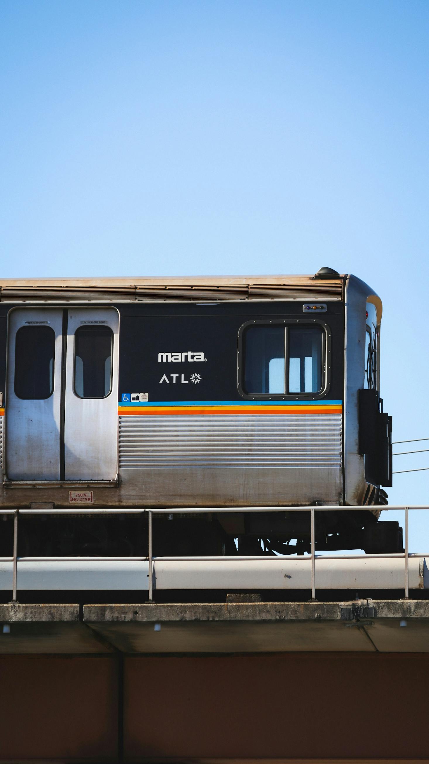 MARTA train car with the ATL logo, parked on an elevated platform