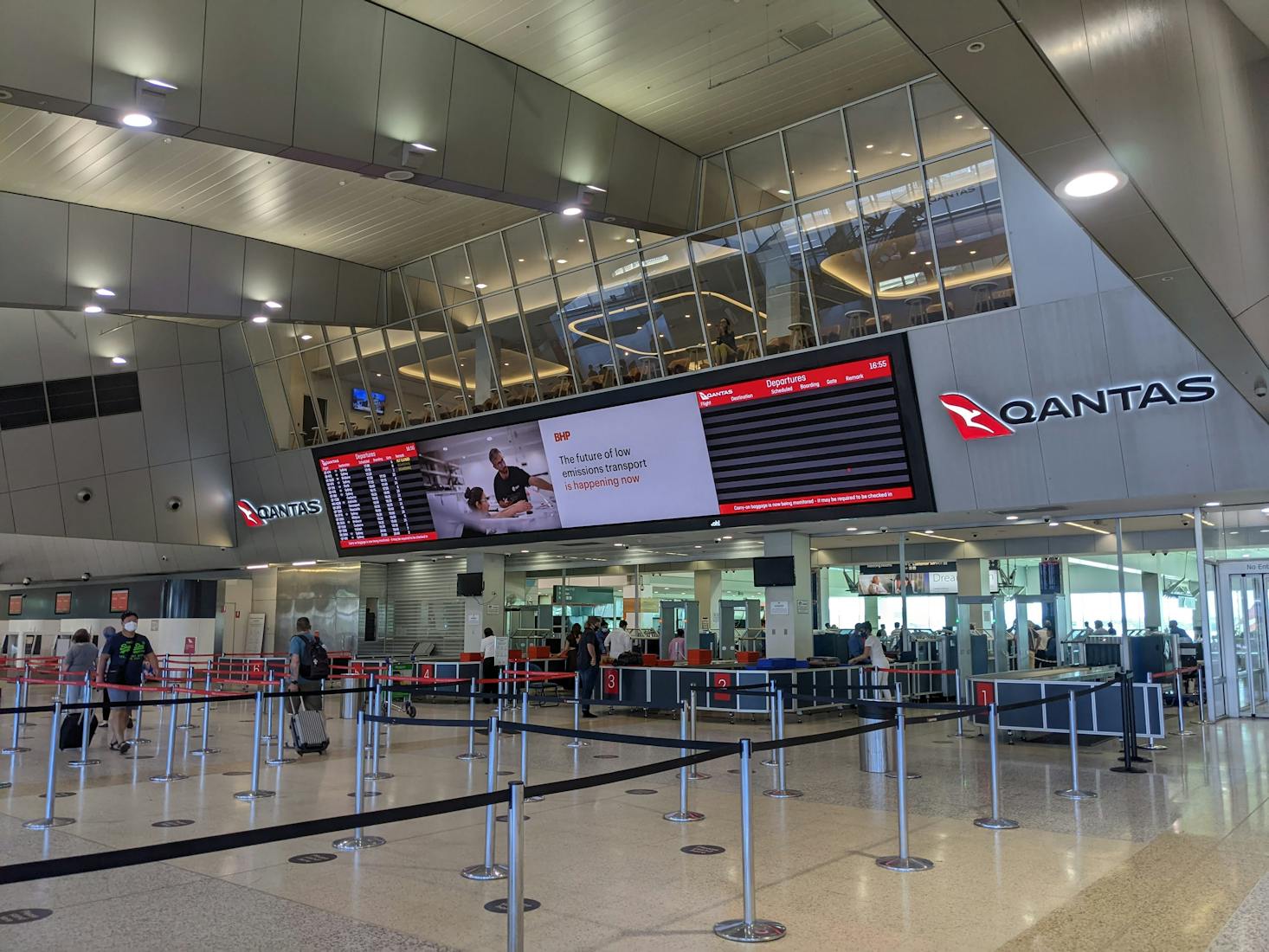 The modern and sleek check-in area at Sydney Airport.