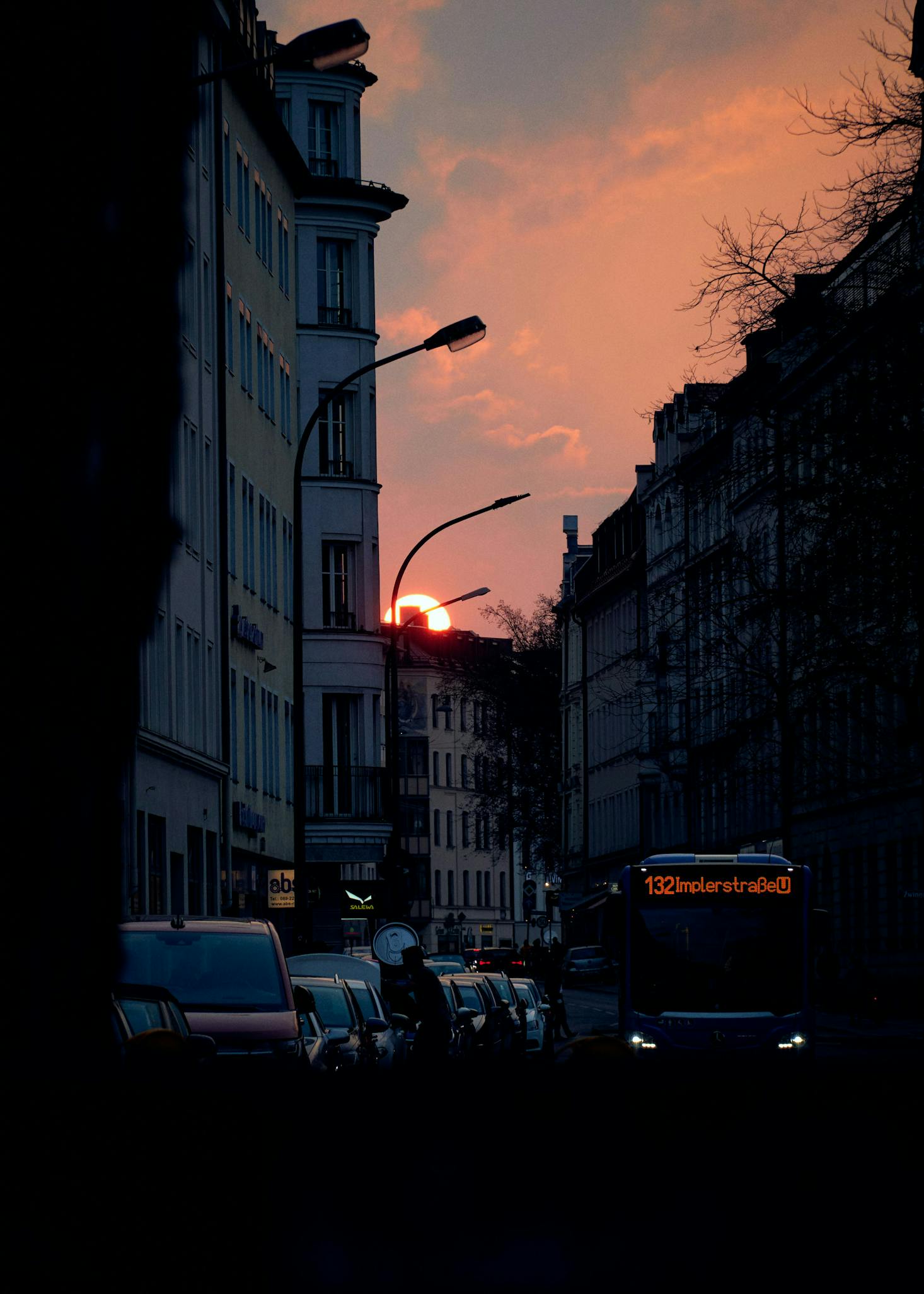 Bus on the Munich streets at sunset heading to Munich Central Bus Station ZOB