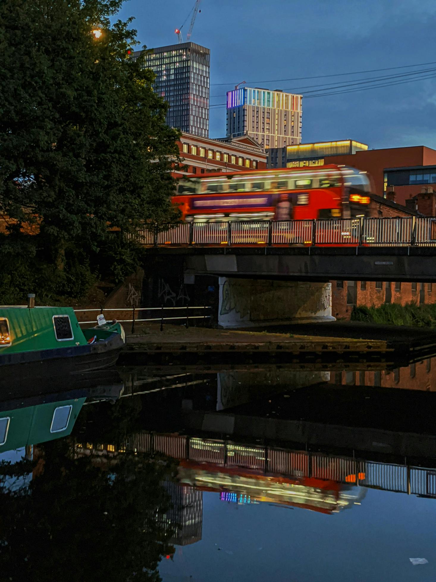 Red double-decker bus traveling on the street near Birmingham Coach Station