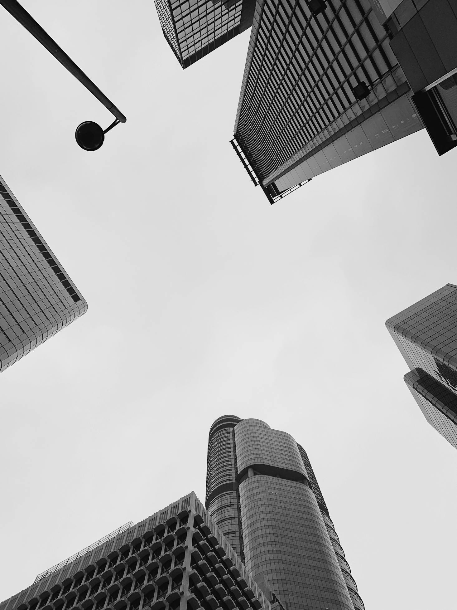 Grey buildings rise into the sky at Mong Kok Station, Hong Kong