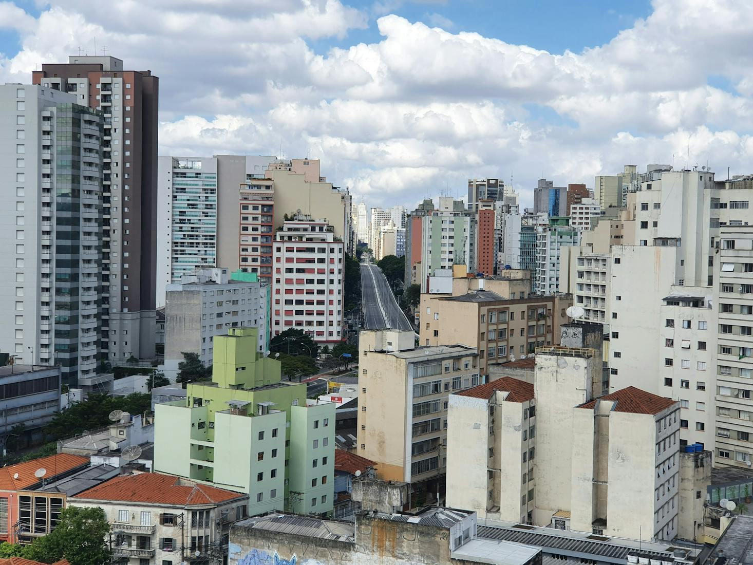 Tall buildings in the city of Sao Paulo, Brazil with a cloudy sky in the background