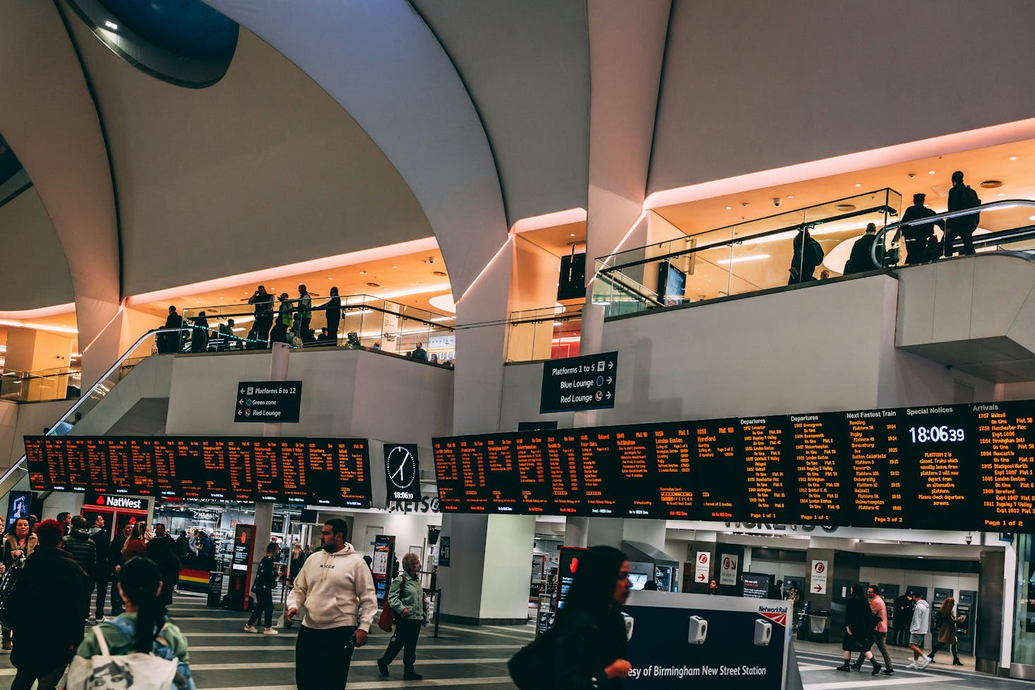 Interior of Birmingham New Street Station with arrival and departure boards 