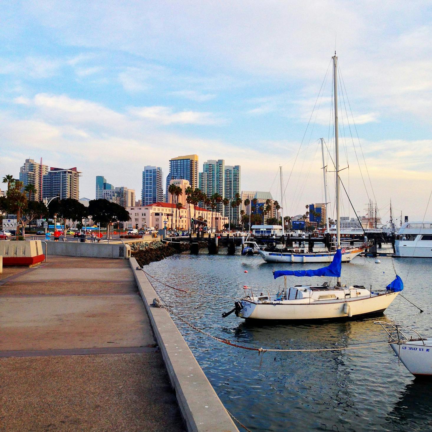 Boats near the San Diego Cruise Terminal with the downtown skyline in the distance