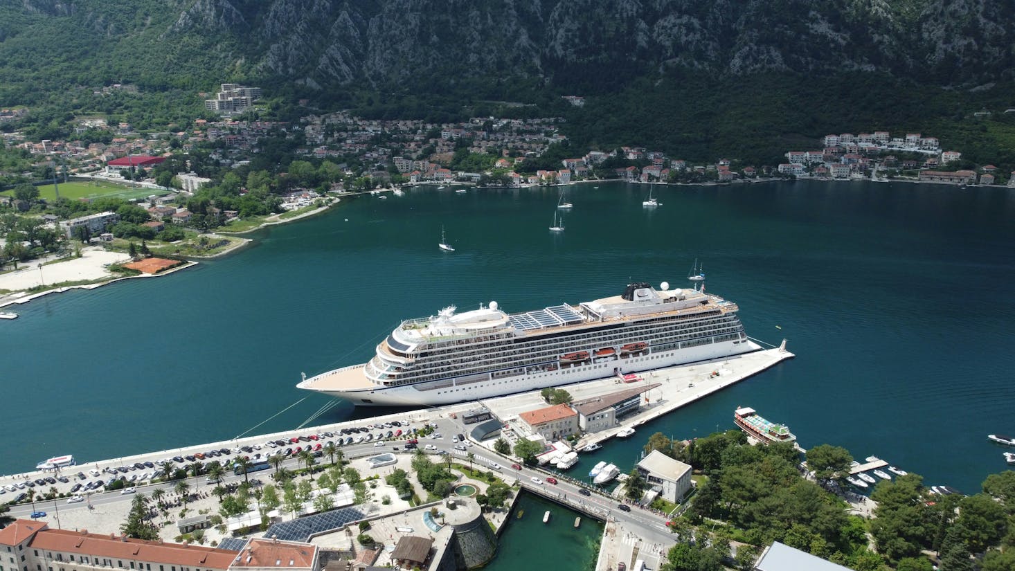 Aerial view of a cruise ship docked at the port in Kotor