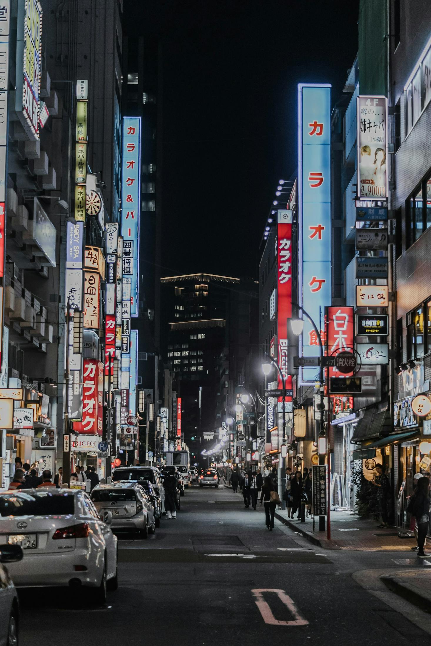 A busy street in Shibuya, Tokyo is lit up at night