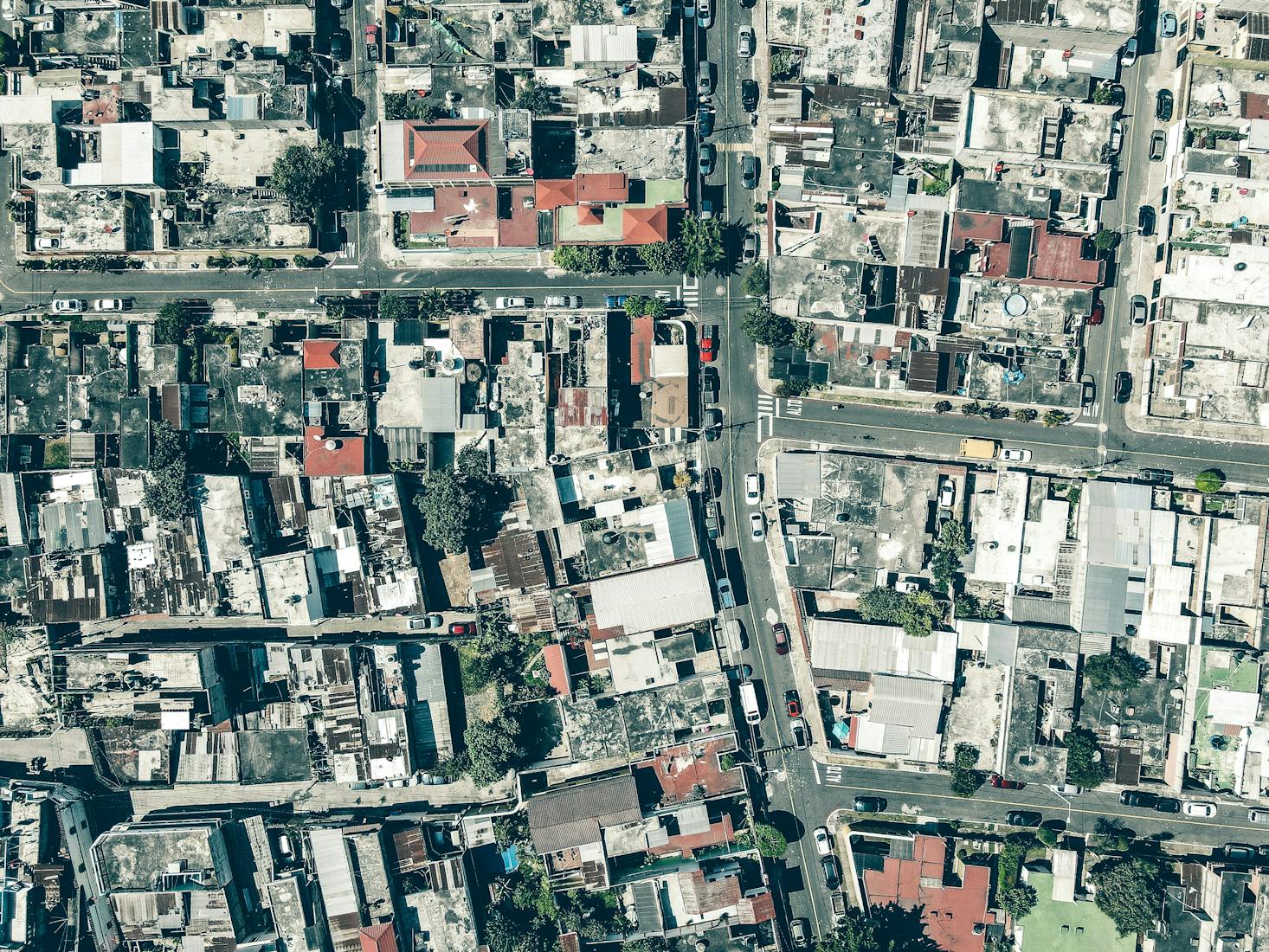 Aerial view of rooftops in Guatemala City from a plane leaving La Aurora International Airport