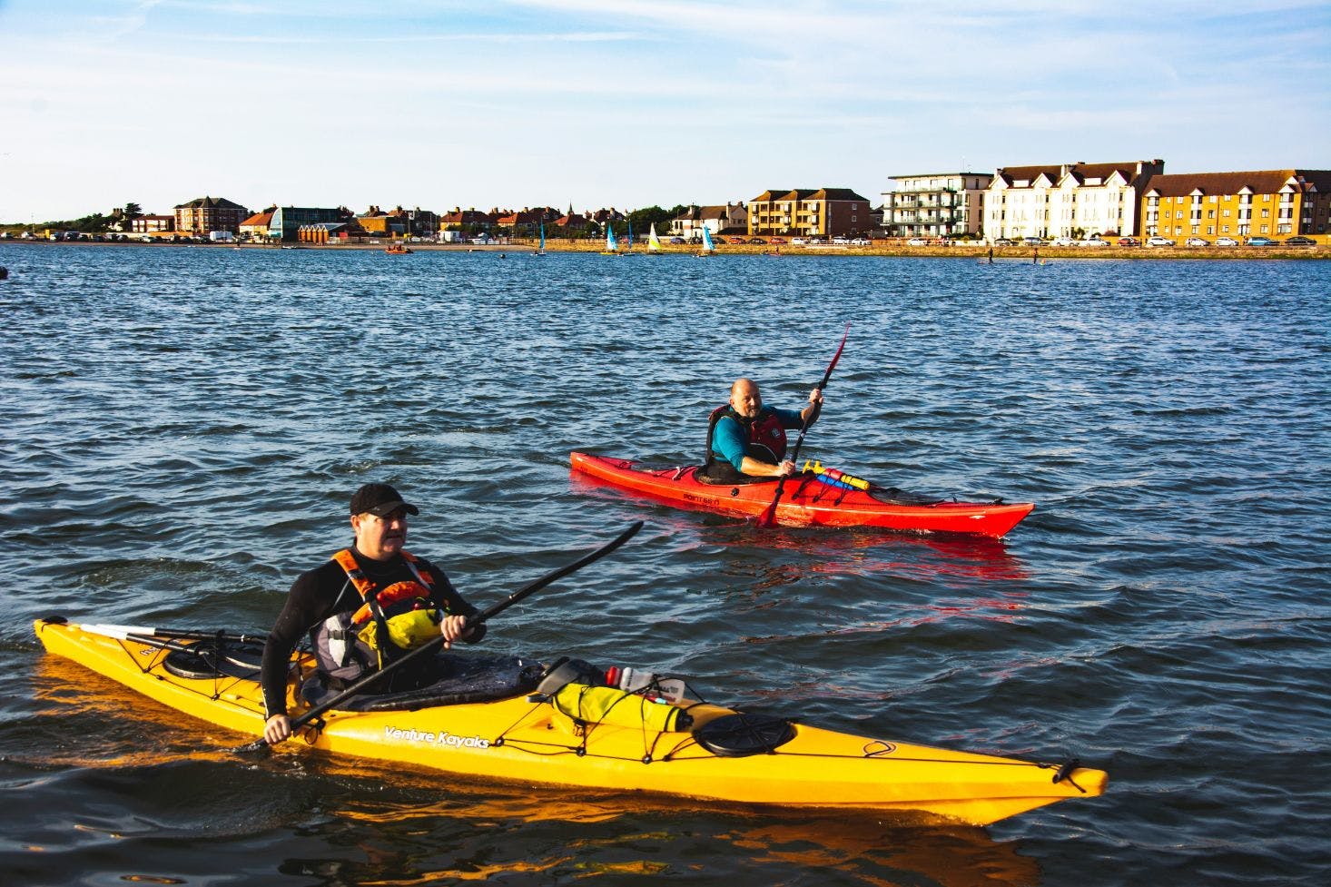 Two kayakers paddling near West Kirby Beach